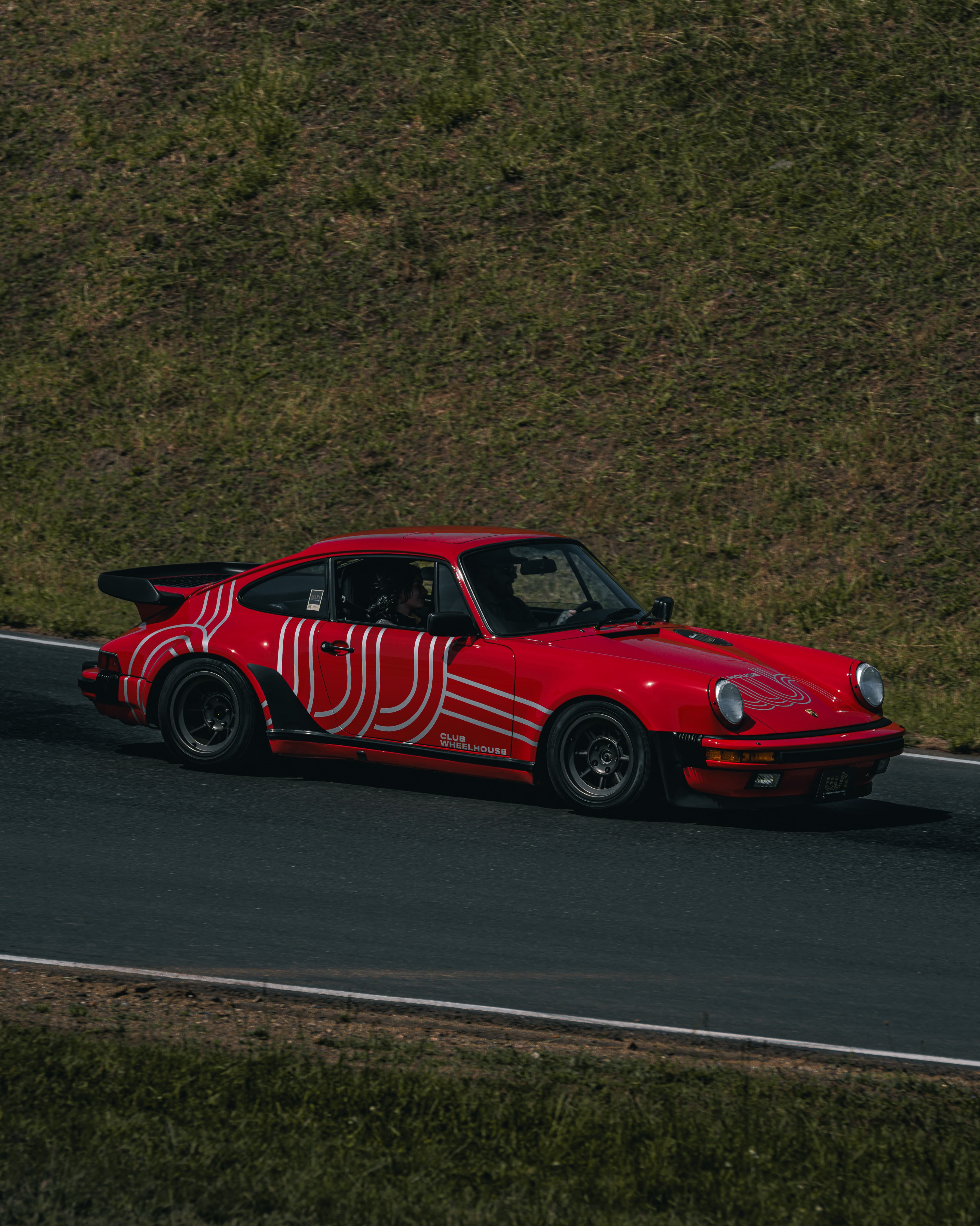 Porsche 911 GT3 at speed on track, cinematic automotive photography