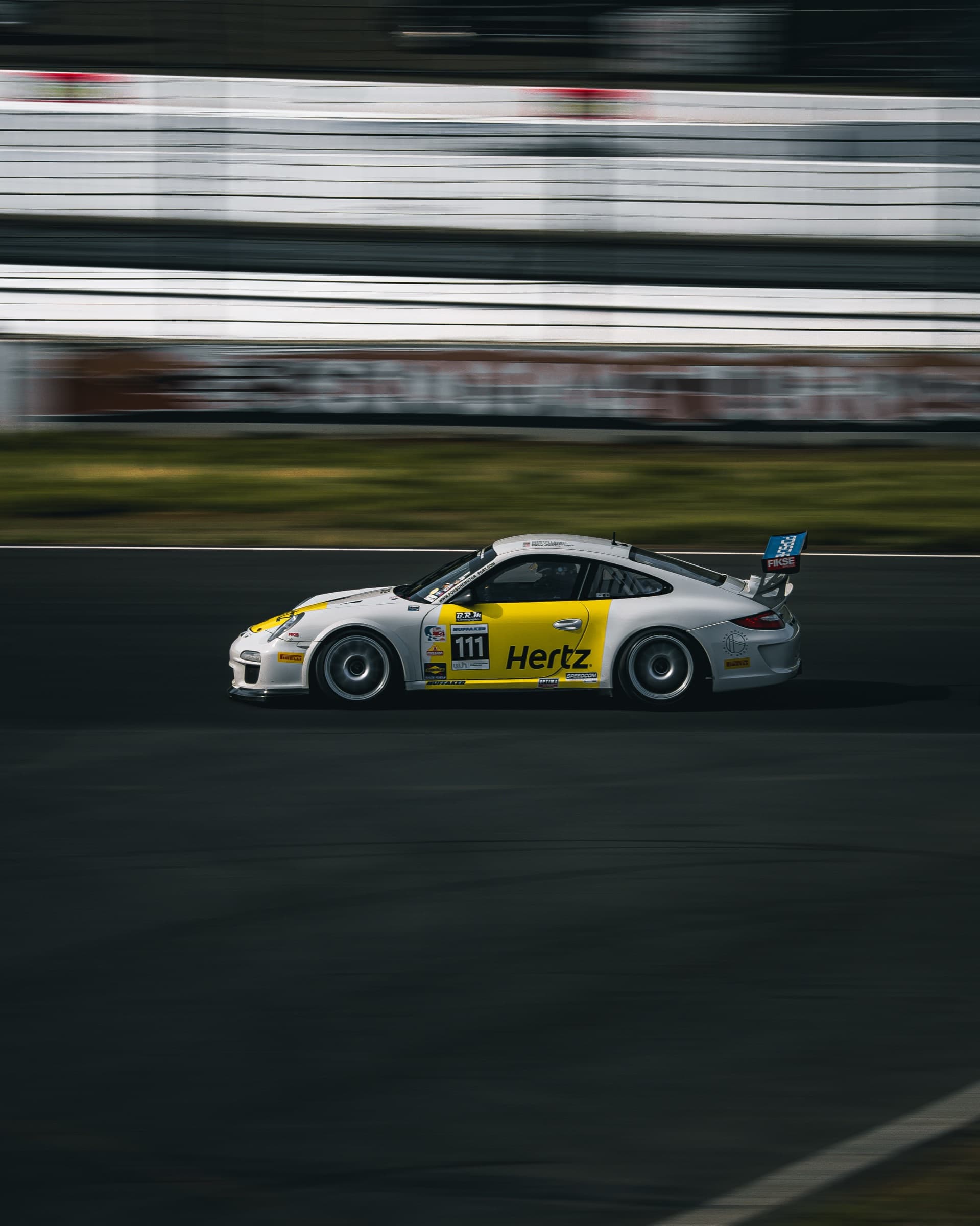 Hertz-liveried Porsche 911 GT3 Cup at speed on track
